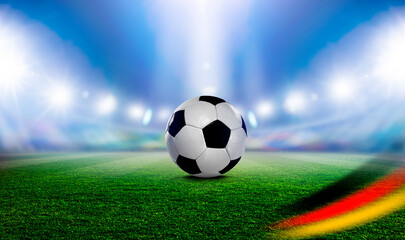 Fototapeta premium Fußball im einer Fussballarena im Scheinwerferlicht 2024