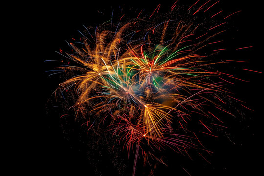 wonderful bright multicolored fireworks exploding in the black night sky