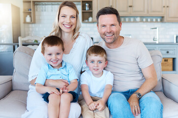 Obraz premium Portrait, young boys and people with play, happiness and bonding as family in home for growth or child development. Cheerful siblings, father and mother with kids as parents for love, relax or care