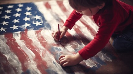 Obraz premium Little boy drawing the American flag with crayons, showcasing creativity and patriotism on a wooden surface.