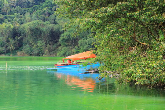 A traditional boat on the shores of Lake Linow, a volcanic lake with high sulfur content, Tomohon, North Sulawesi.