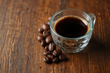 A mug of coffee with a wooden table and a napkin