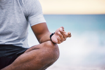 Man, hands and lotus with meditation on beach for peace, mindfulness and calm in nature for wellness or wellbeing. Person, relax and yoga or chakra in outdoor for zen, healing and spiritual energy.