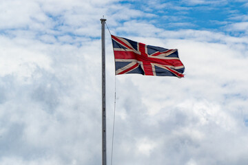 British union jack flag flying at full mast