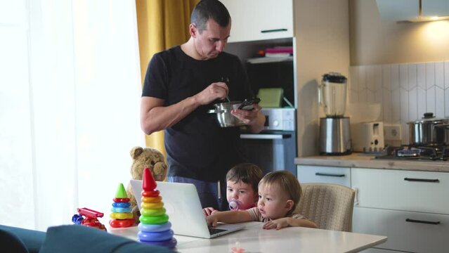 On Father's Day dad and kids share special moments in kitchen representing bond with home and dad. Dad children bond while cooking laughter fills house glorifying Dad. house is filled with family joy.
