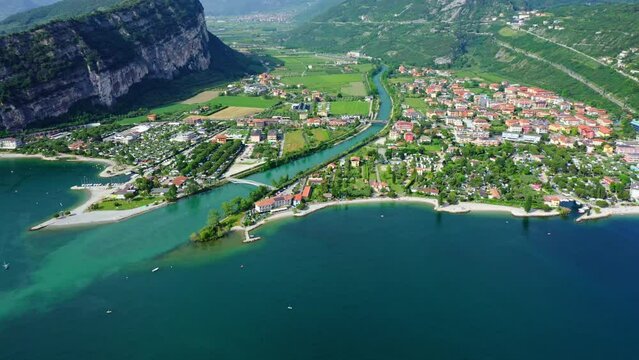 Torbole Lake Garda Aerial View with Mountains, Scenic Blue Water and Italian Town, Idyllic Summer Vacation Destination, Clear Sky and Coastal Road Background
