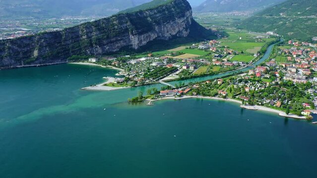 Torbole Lake Garda Aerial View with Mountains, Scenic Blue Water and Italian Town, Idyllic Summer Vacation Destination, Clear Sky and Coastal Road Background