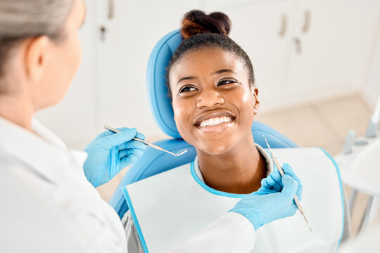 Mirror, smile and woman with tools, dentist and happy for oral health, healthcare and dental hygiene. Teeth, mouth and results for wellness of person, specialist and exam for treatment of patient