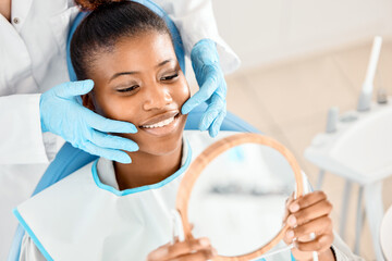 Naklejka premium Mirror, happy and woman with touch, dentist and smile for oral health, healthcare and dental hygiene. Teeth, mouth and results for wellness of person, specialist and exam for treatment of patient