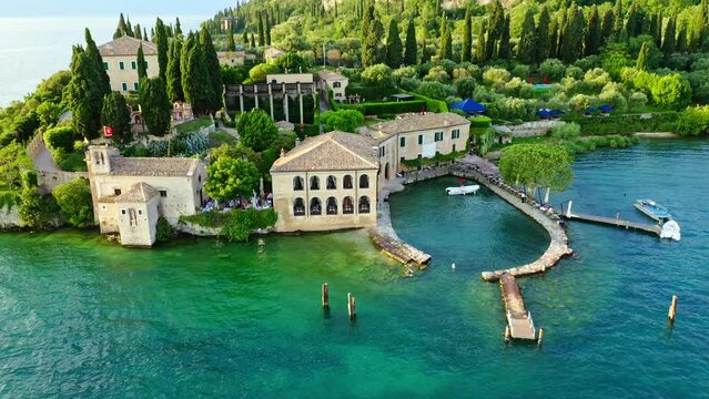 Punta San Vigilio Lake Garda Aerial View with Blue Water and Shoreline, Idyllic Summer Vacation Destination, Clear Sky and Historic Peninsula Background