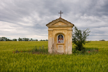 Chapel in cornfield. Middle Bohemia