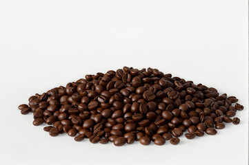 Pile of roasted coffee beans on white background