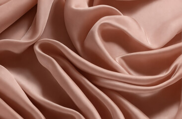 Obraz premium Smooth pink satin fabric draped and folded