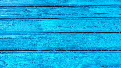 The empty wooden background is blue. Straight lines at different angles, backlight and light gradient. Layout for design or advertising