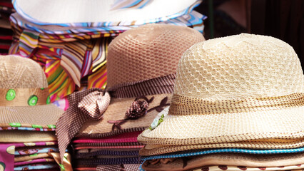 Colorful hats displayed in a street shop