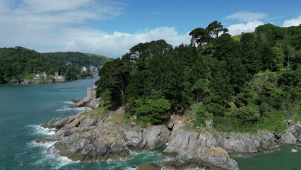 Fototapeta premium River Dart, South Devon, England: DRONE VIEWS: The rugged coastline at the mouth of the River Dart. Dartmouth and the River Dart are popular UK holiday destinations (2).
