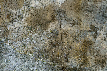 An old wall, the texture of a painted concrete wall. an abstract background covered with dirty old paint.