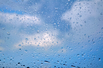 Drops of water after rain on the surface of window glass.