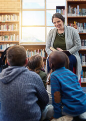 Library, children and teacher reading book, learning and education with knowledge, storytelling and...