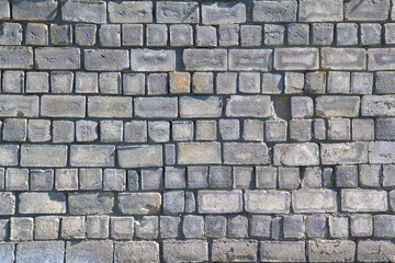 Old gray cement background with cinder block wall.