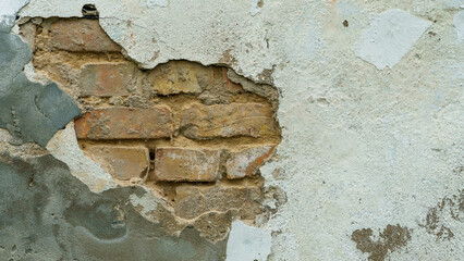 The surface is made of old red brick. A wall of old historical buildings made of broken bricks and collapsed plaster. A clean background for the design.