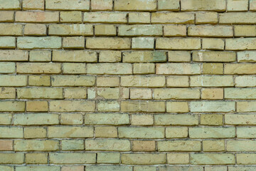 The surface is made of old red brick. A wall of old historical buildings made of broken bricks and collapsed plaster. A clean background for the design.