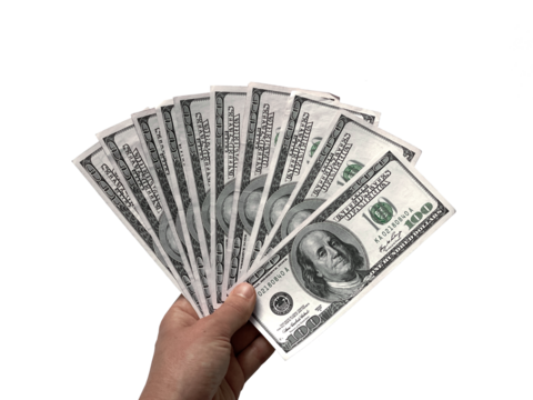 Hand holding American dollars, 100 US dollar banknotes isolated on white background