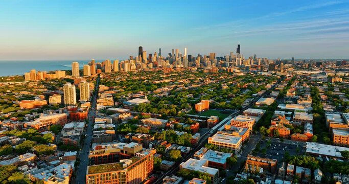 Beautiful panorama of green neighborhood of Chicago, Illinois, US. Downtown of the city with splendid skyscrapers at backdrop. Top view.