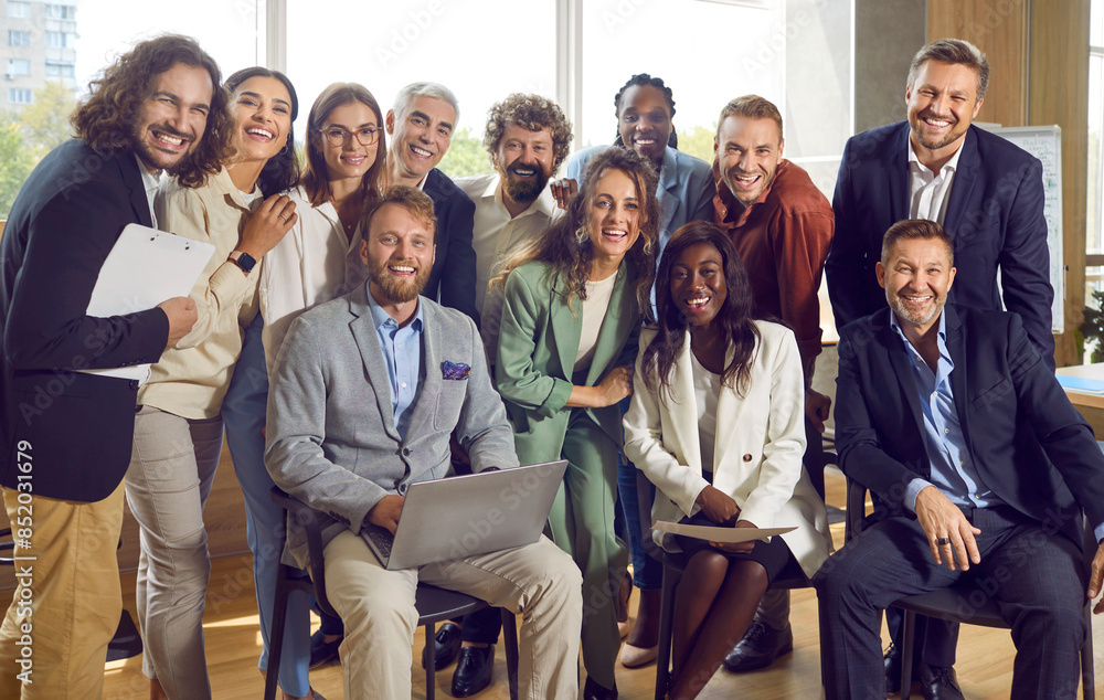 Poster Group portrait of a happy smiling diverse business people at work in office. Staff and company employees men and women looking cheerful at the camera during a meeting or a conference.