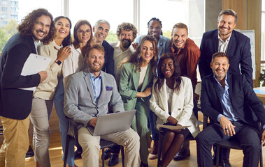Group portrait of a happy smiling diverse business people at work in office. Staff and company...