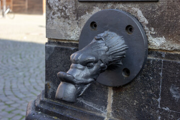Historic waterspout sculpture in Cologne, Germany