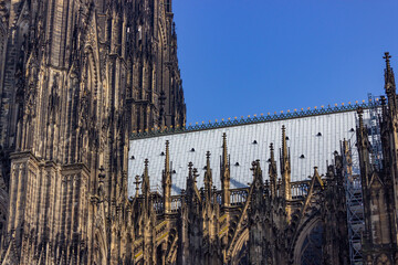 Roof and spires of the southern side of Hohe Domkirche St. Petrus (Cologne Cathedral) in Cologne, Germany