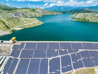 Vau i Dejës lake in Shkoder, northern Albania showing the Hydroelectric damn covered with Solar...