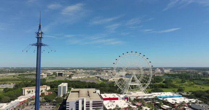 Orlando Starflyer swing ride and Ferris wheel. Attraction for tourists on International Drive in Orlando, Florida. USA travel destination