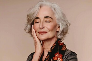 stunning portrait of a mature woman in her 50s with flawless skin, gently touching her face with eyes closed. Perfect for advertising facial anti-aging lift products and salon care services.