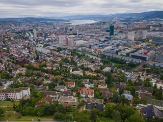 Zurich Switzerland residential area by the river Limmat with industrial area on the other riverside towards the lake, aerial view, drone shot