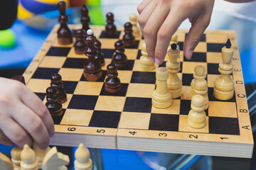 Chess tournament, kids and adults participate in chess match game in indoor hall, players of all...