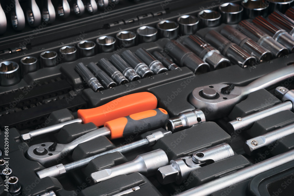 Poster A toolbox with many different tools including pliers, wrenches, and screwdrivers. The tools are organized in a way that makes it easy to find what you need