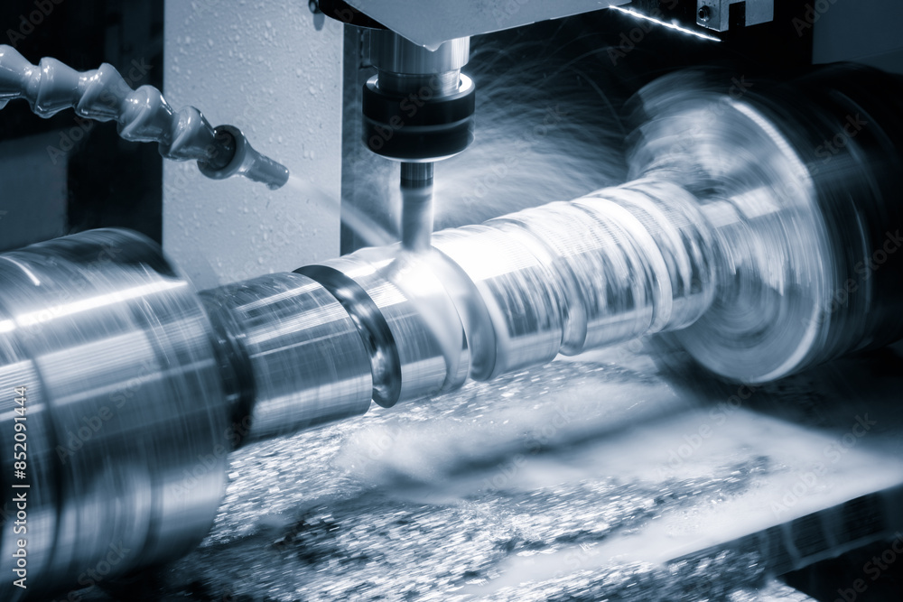 Poster a machine is grinding a piece of metal. the grinding process is creating a lot of dust and debris