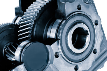 A close up of a gear with a black cap on it. The gear is part of a larger machine