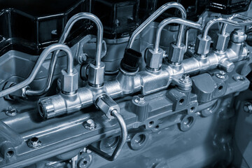 Black diesel engine. Fragment of a diesel motor close-up. Selective on the fuel injection in the...