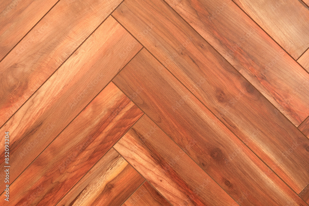 Poster a wooden floor with a chevron pattern. the wood grain is visible, and the floor appears to be made o