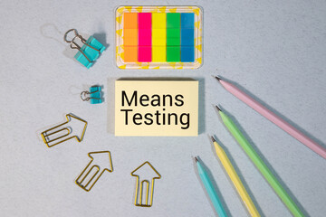 means testing, text on white notepad paper on gray background