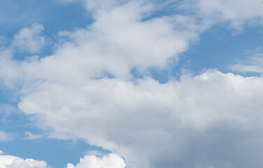 Obraz premium blue sky with clouds,blue sky and white clouds on day time for background usage, White clouds on blue sky background, abstract wallpaper of nature, clouds in the blue sky, beautiful clouds against blu