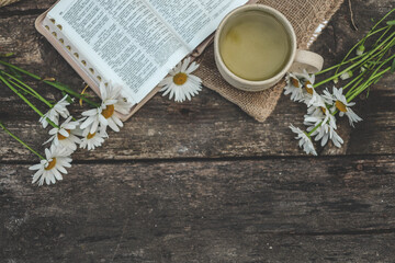 Cup with the inscription blessed and open Bible, Christian concept