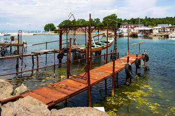 Pier constructions with a lifted boat at the Fishing Village Port, Chengene Skele, Province of Burgas, Bulgarian Black Sea