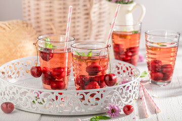 Fresh and sweet lemonade with cherries and crushed ice.
