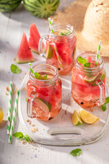 Fresh and cold lemonade with fruits and crushed ice.