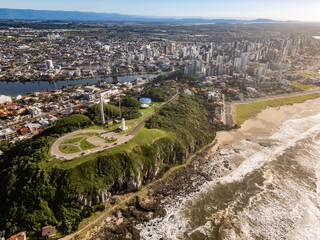 Aerial view of lighthouse and city center and lake