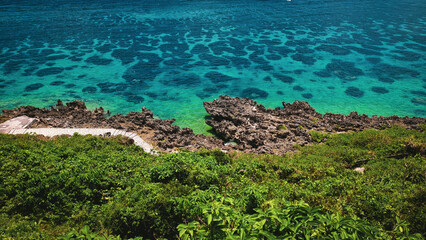 Crystal Clear Waters and Rocky Coastline of a Tropical Paradise